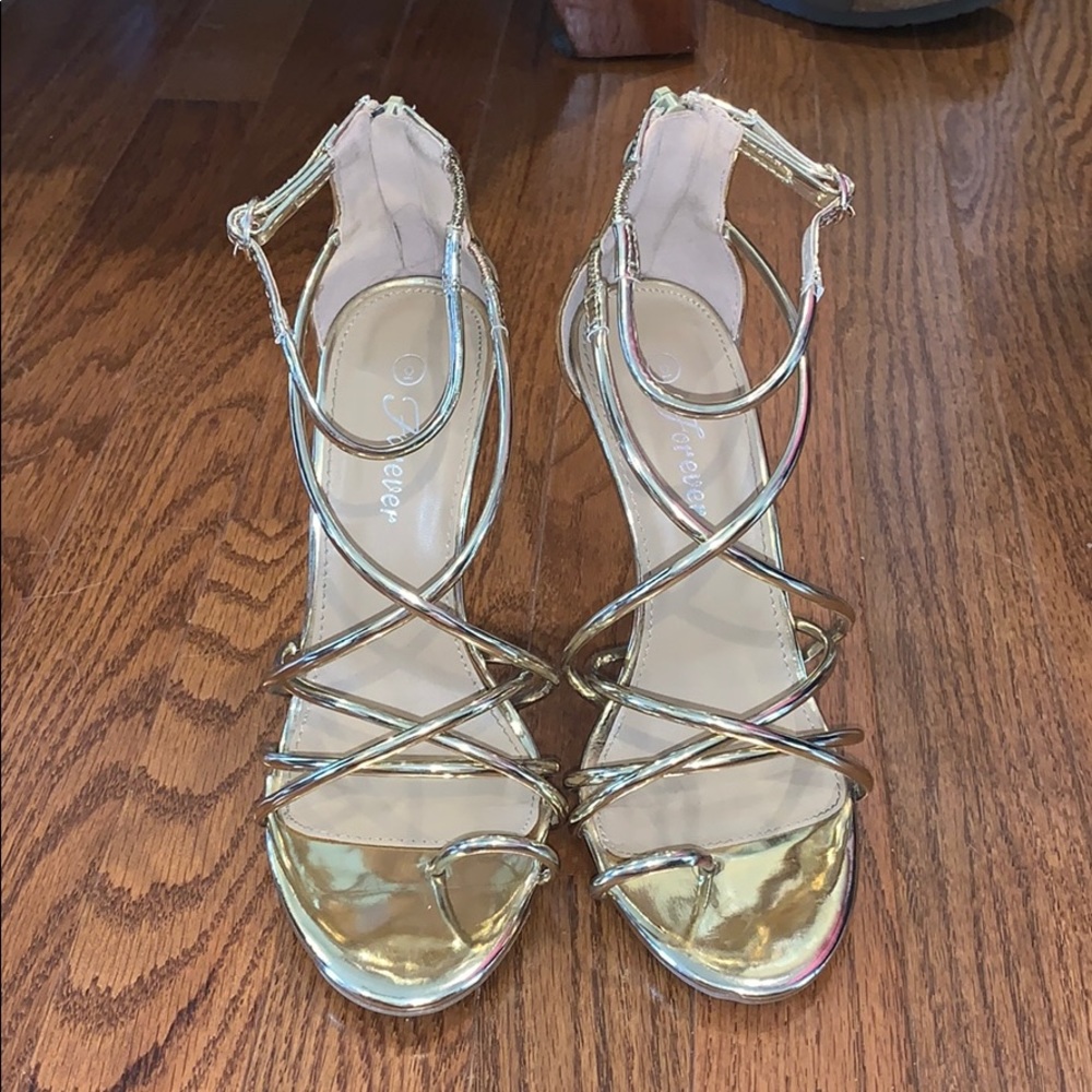 Gold strappy heels